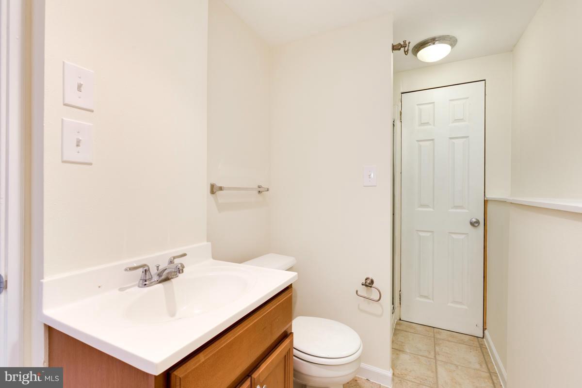 11052 Granby Court Reston, VA 20191 - Photo 21 of 28 a bathroom with a sink a toilet and shower