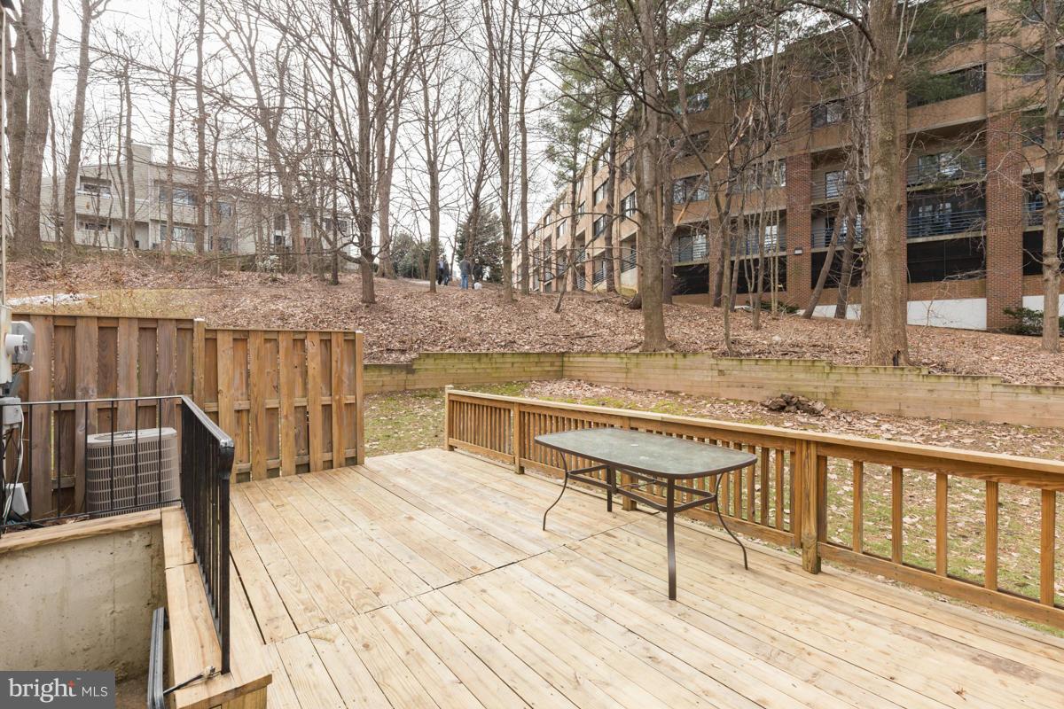 11052 Granby Court Reston, VA 20191 - Photo 23 of 28 a view of a roof deck with wooden floor and fence