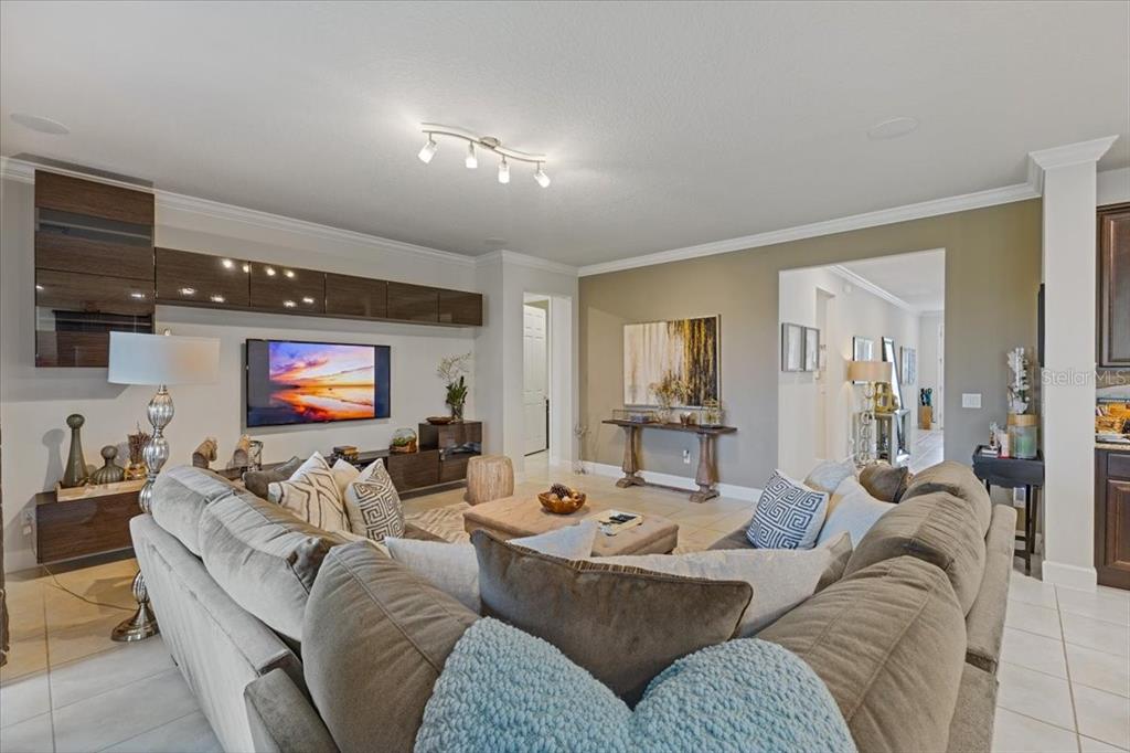 7180 Beek Street Windermere, FL 34786 - Photo 7 of 33 a living room with furniture and a flat screen tv