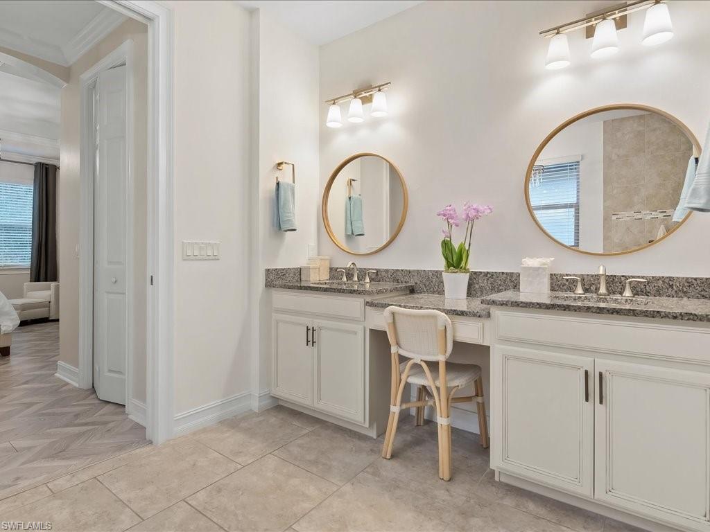 16242 Aberdeen Way Naples, FL 34110 - Photo 16 of 30 a bathroom with a granite countertop double vanity sink and a mirror