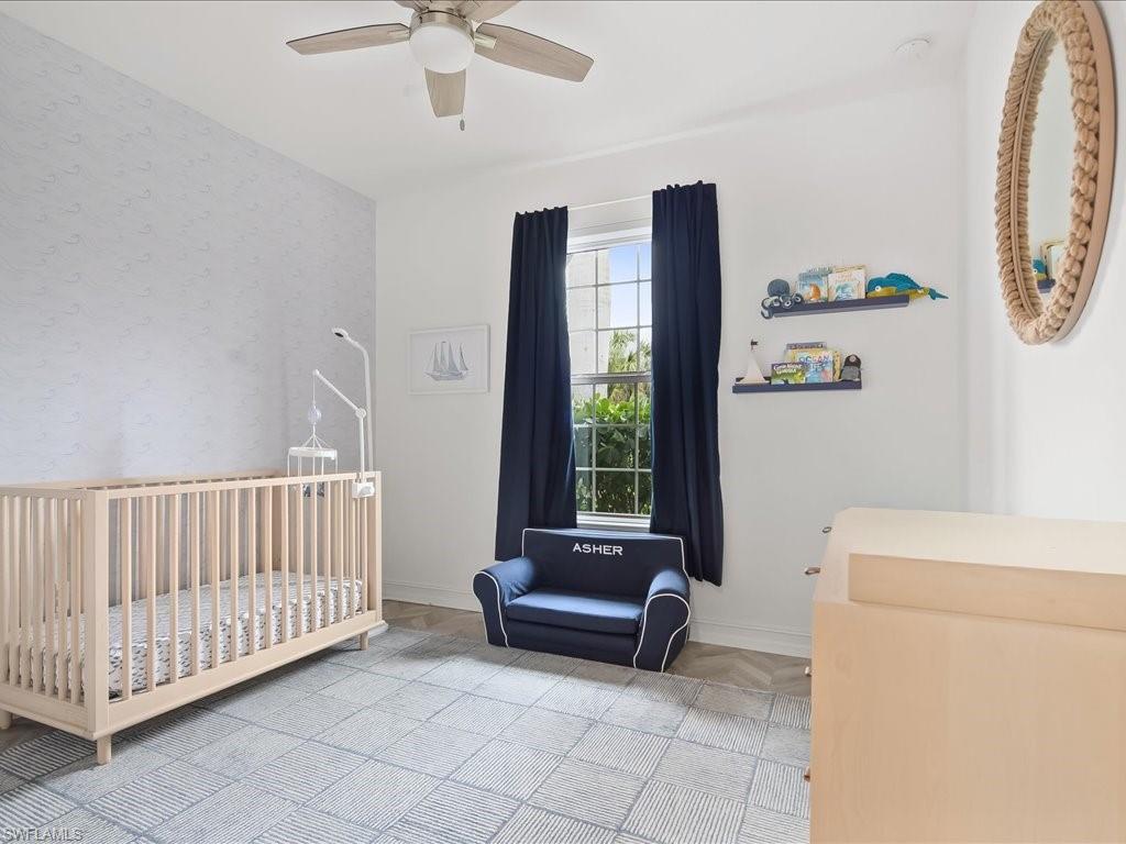 16242 Aberdeen Way Naples, FL 34110 - Photo 19 of 30 a bedroom with furniture and a window