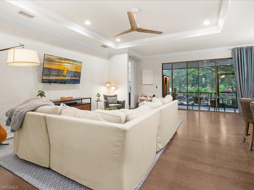 16242 Aberdeen Way Naples, FL 34110 - Photo 4 of 30 a living room with furniture and a large window