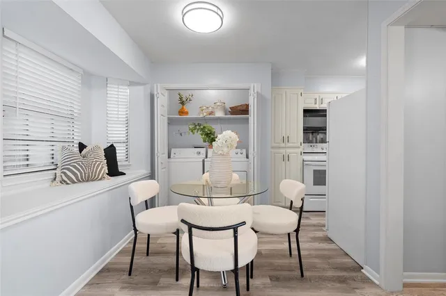 a dining room with furniture and window