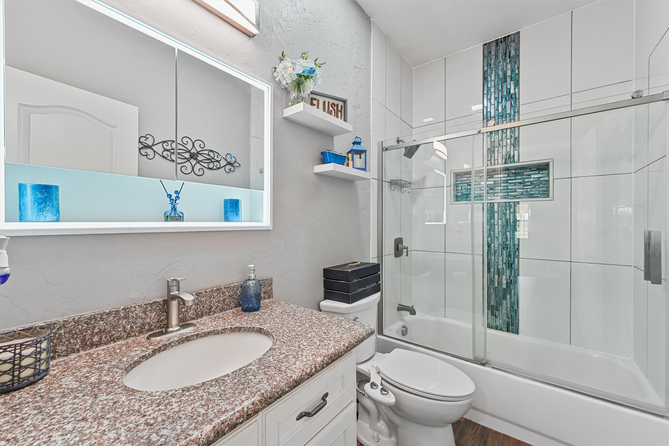 19545 Crosby Eastgate Road Crosby, TX 77532 - Photo 20 of 26 a bathroom with a granite countertop sink toilet a mirror and shower