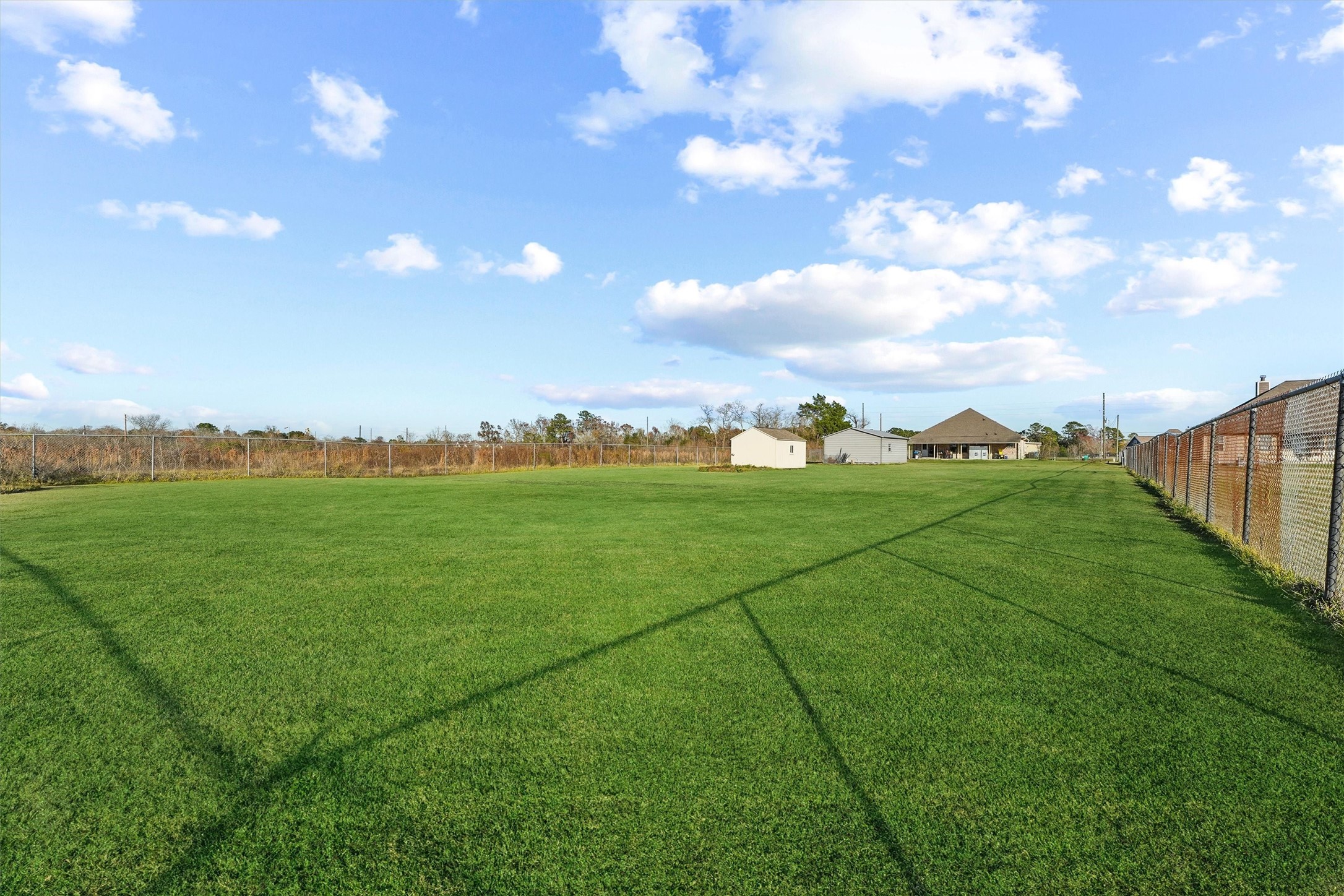 19545 Crosby Eastgate Road Crosby, TX 77532 - Photo 24 of 26 a view of a green field with clear sky