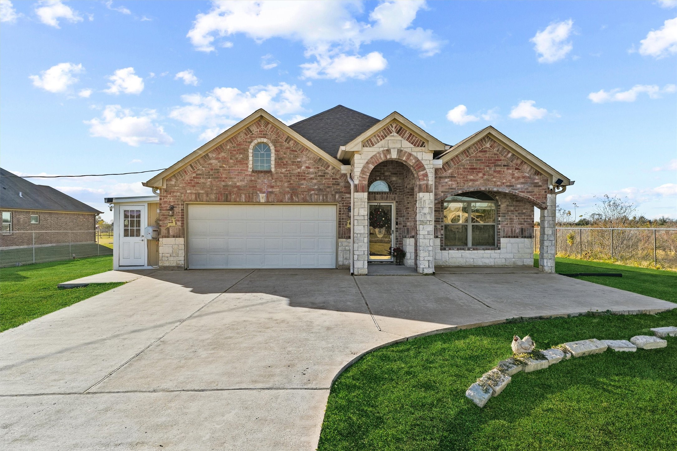 19545 Crosby Eastgate Road Crosby, TX 77532 - Photo 5 of 26 a front view of a house with a yard and garage