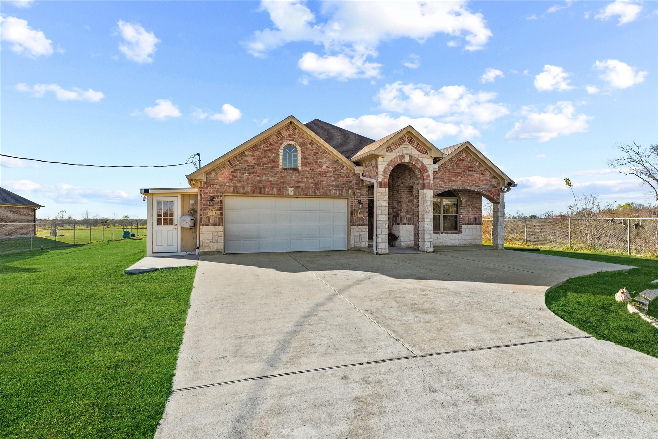 19545 Crosby Eastgate Road Crosby, TX 77532 - Photo 6 of 26 a front view of a house with a garden and yard