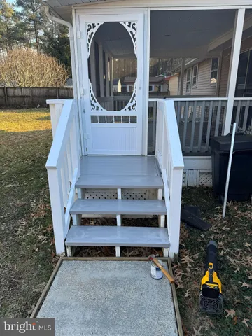 a white toilet and tub sitting next to a bathroom sink