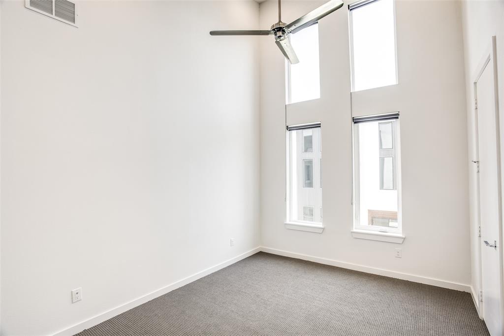 2180 Bennett Avenue, Unit 303 Dallas, TX 75206 - Photo 14 of 24 a view of an empty room with a window