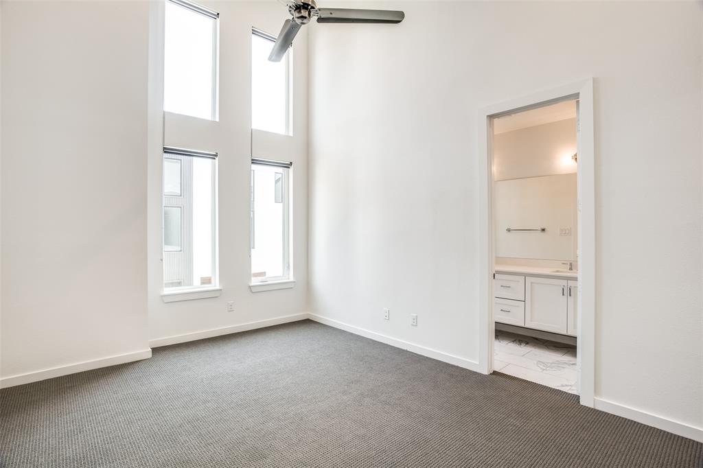 2180 Bennett Avenue, Unit 303 Dallas, TX 75206 - Photo 17 of 24 an empty room with windows and closet
