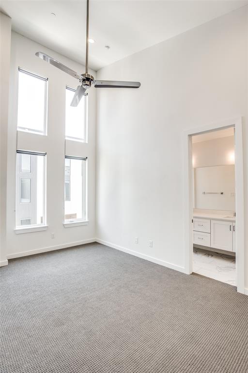 2180 Bennett Avenue, Unit 303 Dallas, TX 75206 - Photo 18 of 24 an empty room with windows and cabinet