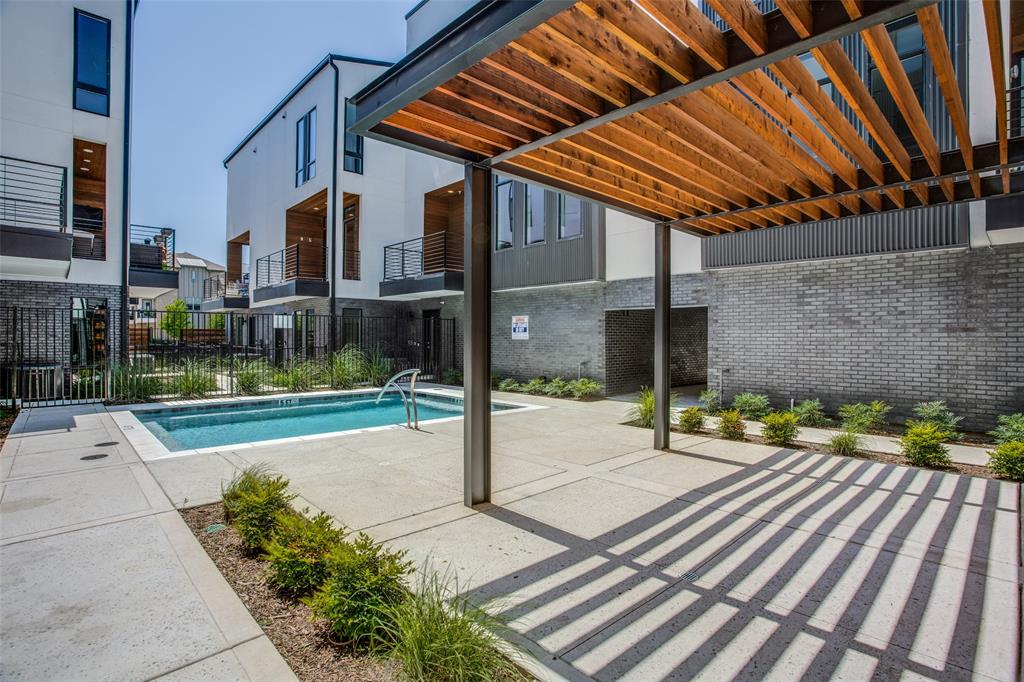 2180 Bennett Avenue, Unit 303 Dallas, TX 75206 - Photo 23 of 24 a view of a chair and tables in the patio with a backyard