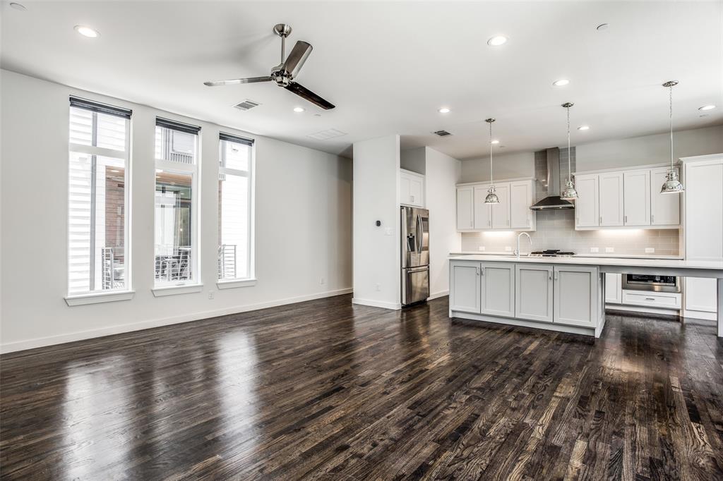 2180 Bennett Avenue, Unit 303 Dallas, TX 75206 - Photo 7 of 24 a large kitchen with stainless steel appliances granite countertop a stove and a large window