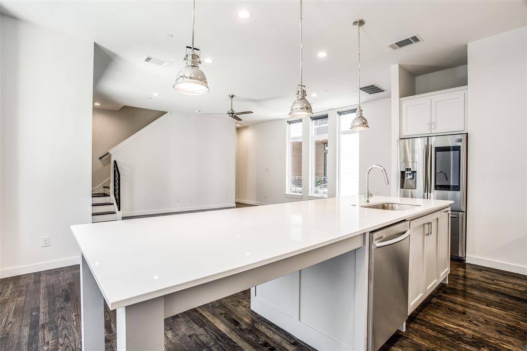 2180 Bennett Avenue, Unit 303 Dallas, TX 75206 - Photo 10 of 24 a large kitchen with stainless steel appliances a large counter top space a sink and cabinets
