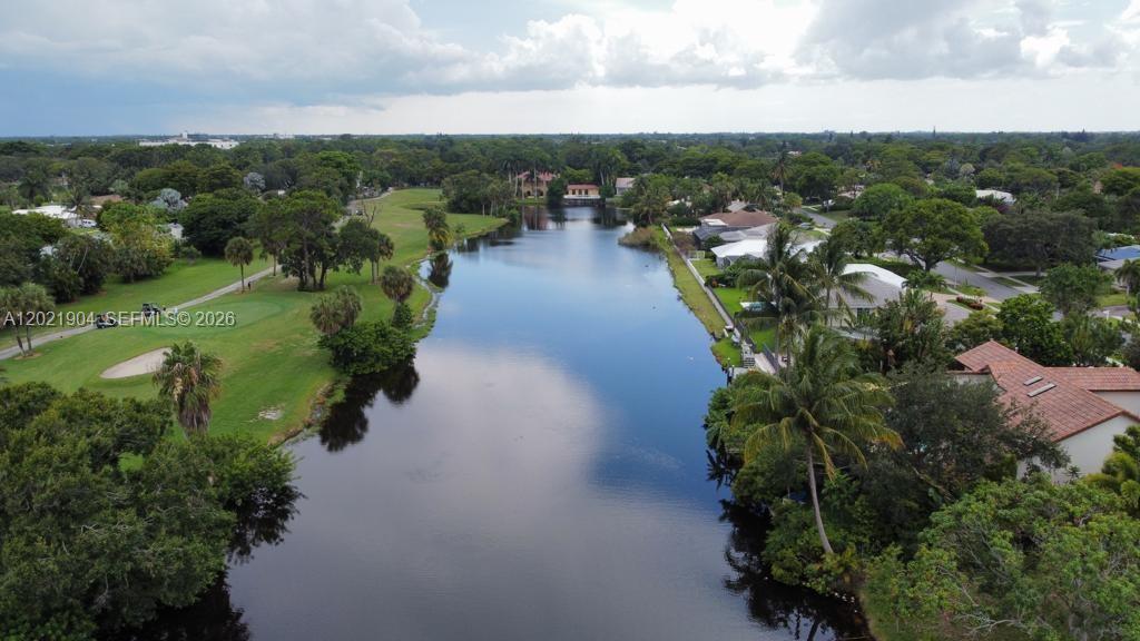 3324 Lakeview Boulevard Delray Beach, FL 33445 - Photo 28 of 36 an aerial view of a city with lots of residential buildings ocean and mountain view in back