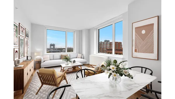a dining room with furniture window and wooden floor