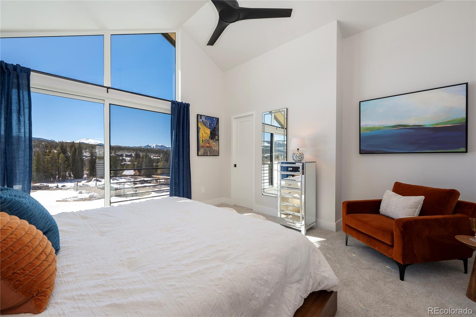 56 Wheeler Road Winter Park, CO 80482 - Photo 24 of 50 a spacious bedroom with a bed and glass window