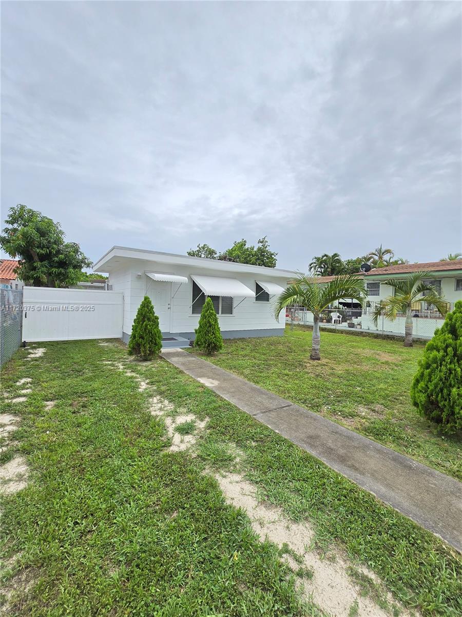 2810 Southwest 24th Terrace, Unit 2 Miami, FL 33145 - Photo 1 of 6 a view of a house with a yard