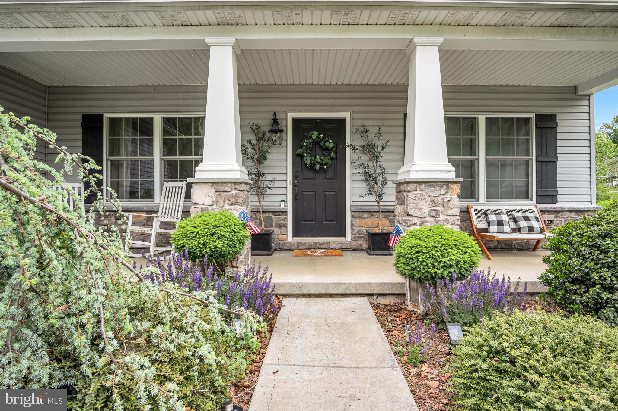 110 Freys Road Elizabethtown, PA 17022 - Photo 3 of 47 Charming porch with lush greenery.