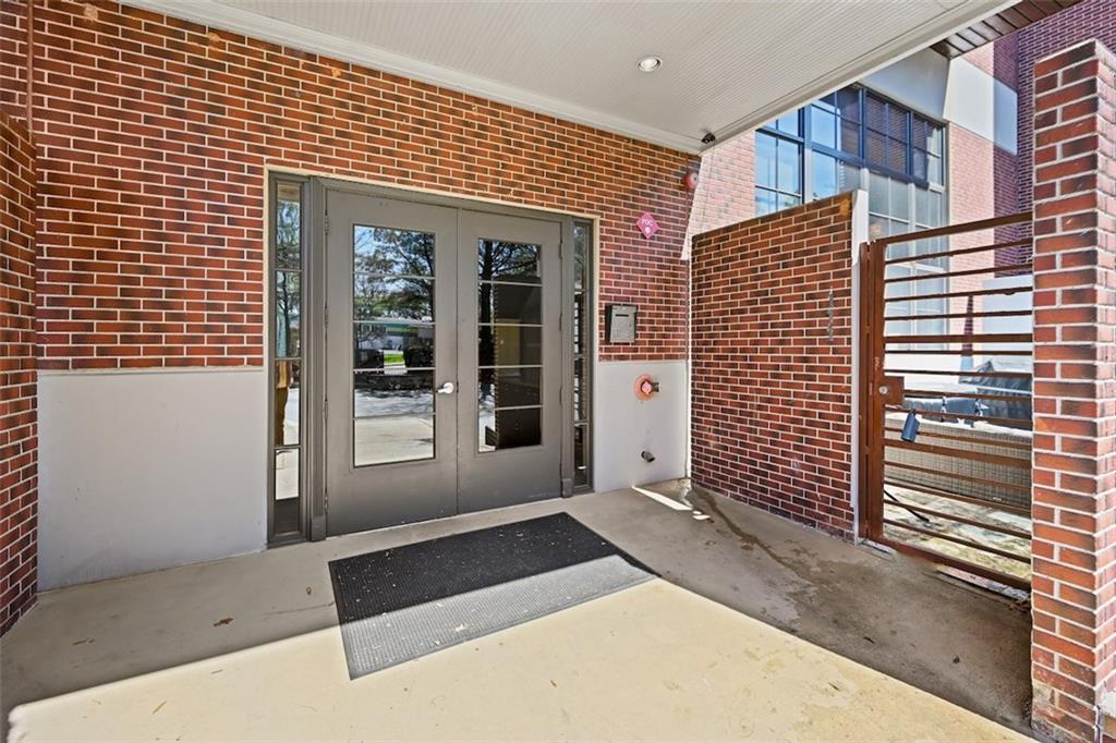 790 North Avenue Northeast, Unit 111 Atlanta, GA 30306 - Photo 27 of 41 a view of a brick house with a large window