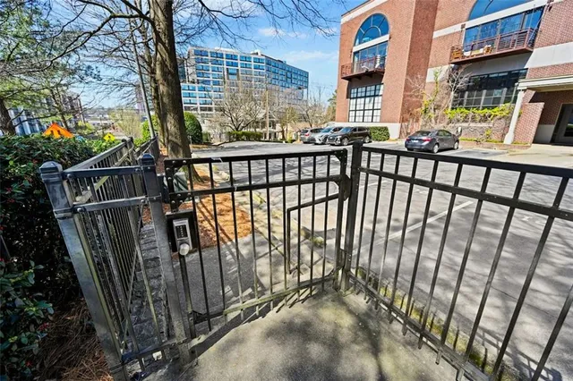 a view of a balcony with two chairs and wooden floor