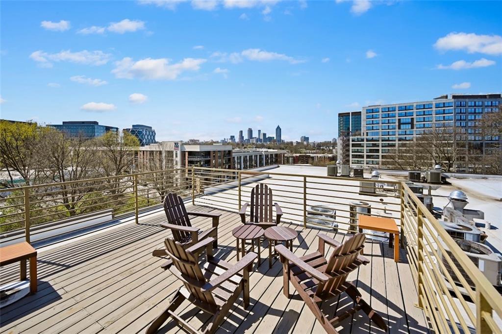 790 North Avenue Northeast, Unit 111 Atlanta, GA 30306 - Photo 32 of 41 a view of a balcony with two chairs and wooden floor