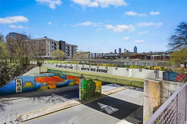 a view of swimming pool with outdoor seating and city view