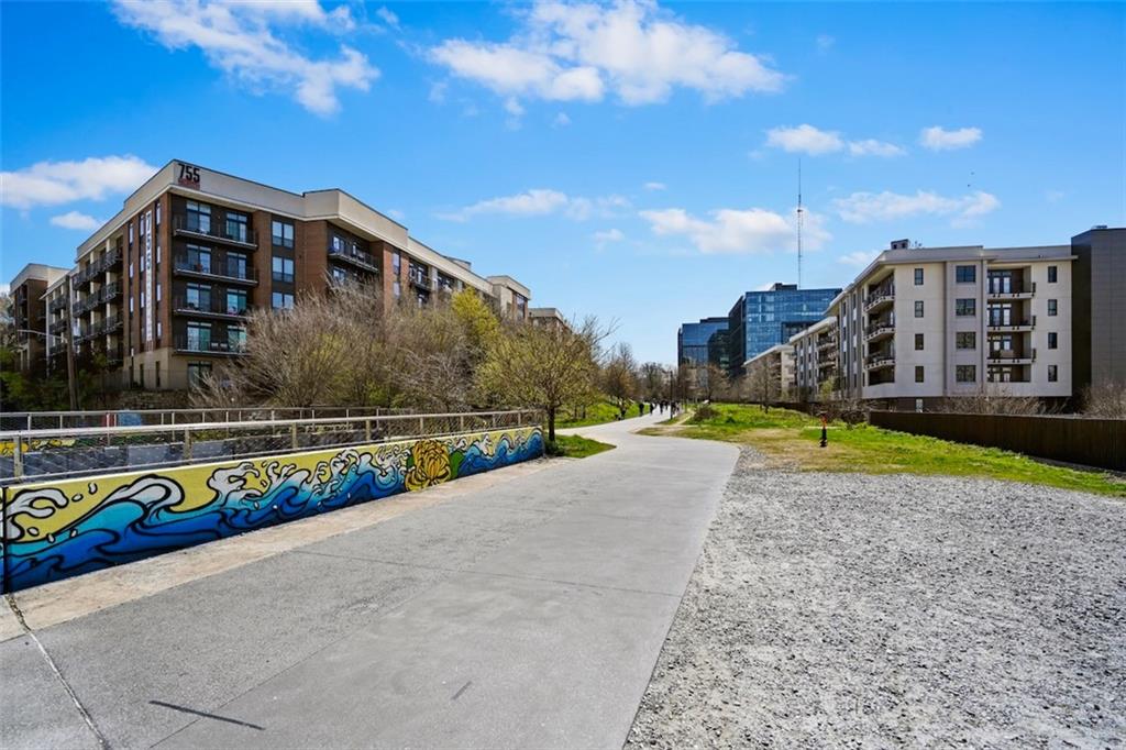 790 North Avenue Northeast, Unit 111 Atlanta, GA 30306 - Photo 37 of 41 a view of swimming pool with outdoor seating and city view
