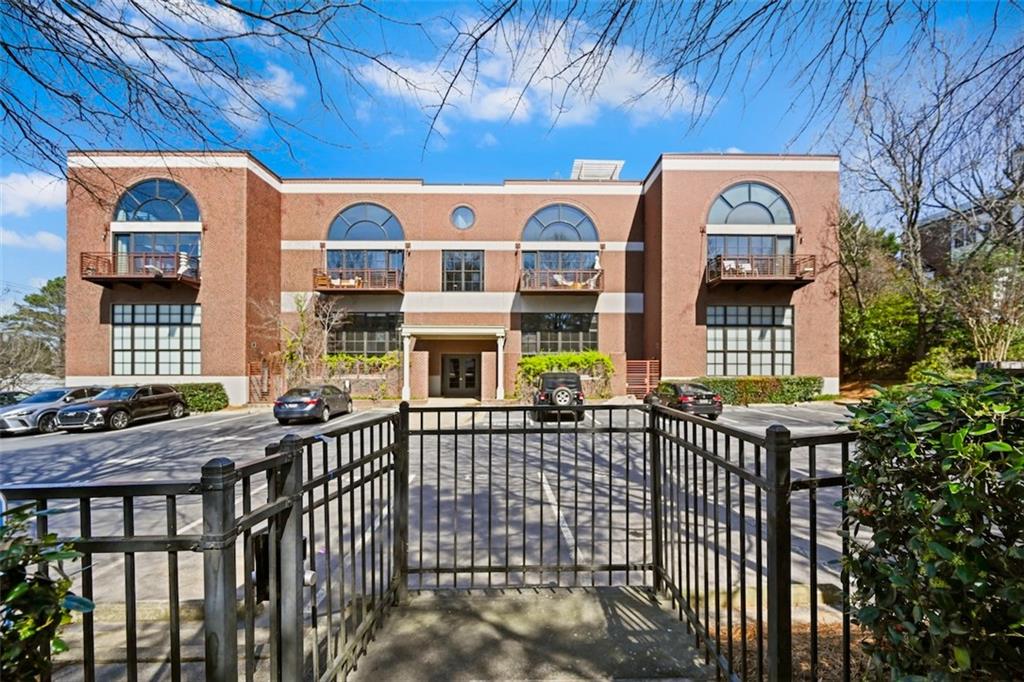 790 North Avenue Northeast, Unit 111 Atlanta, GA 30306 - Photo 39 of 41 a view of a brick house with large windows