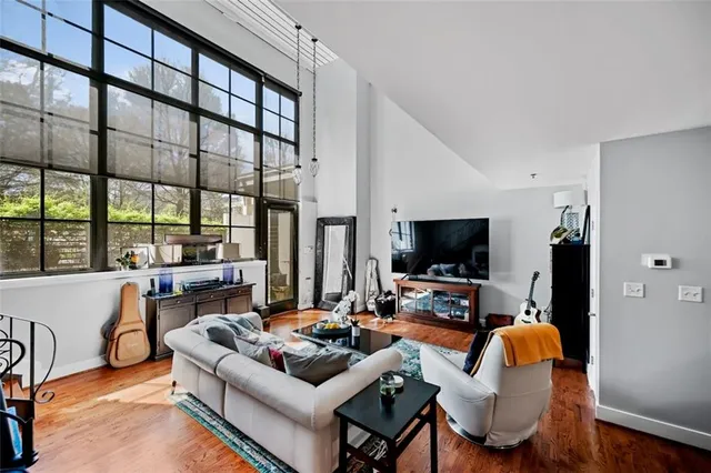 a living room with furniture and a flat screen tv