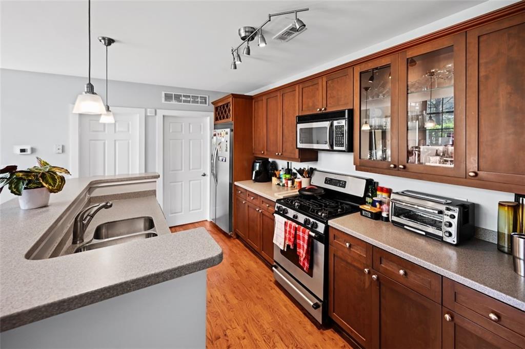790 North Avenue Northeast, Unit 111 Atlanta, GA 30306 - Photo 9 of 41 a kitchen with stainless steel appliances granite countertop a sink stove and refrigerator