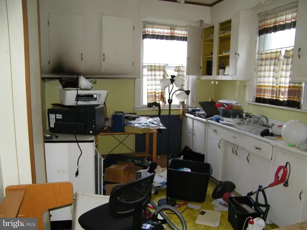 a kitchen with a sink stove and window