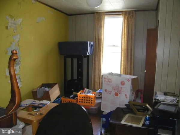 a bedroom with two beds and a window