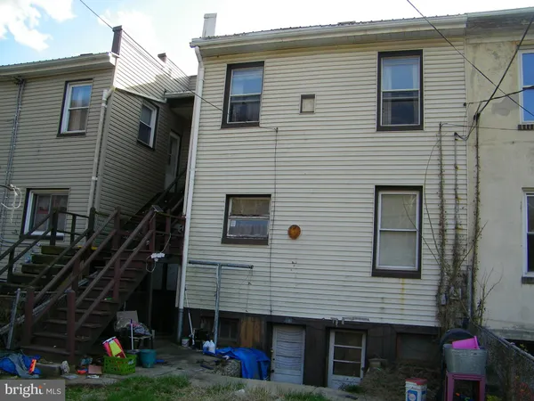 a view of parked car in front of house