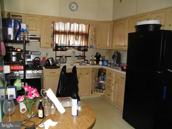 a utility room with sink dryer and washer
