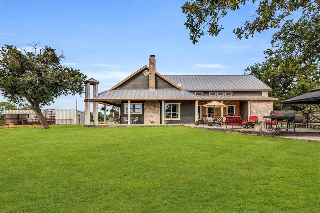a view of a backyard of the house