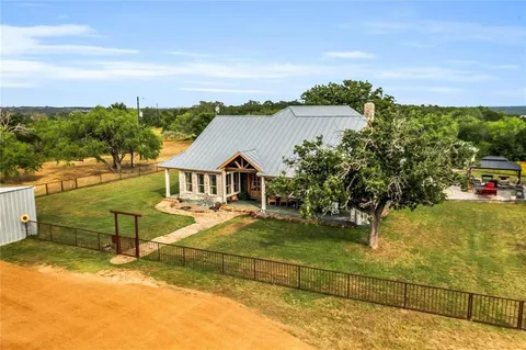 an aerial view of a house with a garden