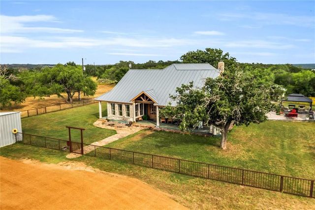 an aerial view of a house with a garden