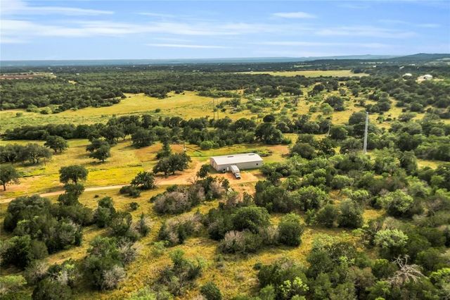 a view of a houses with a yard