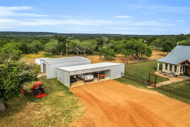 a view of a dining room with furniture wooden floor and chandelier