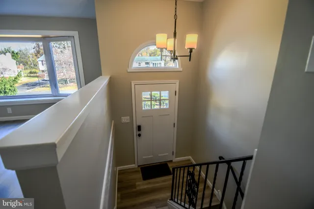 a view of a hallway with windows