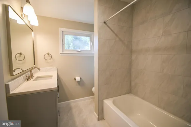 a bathroom with a sink and a bathtub