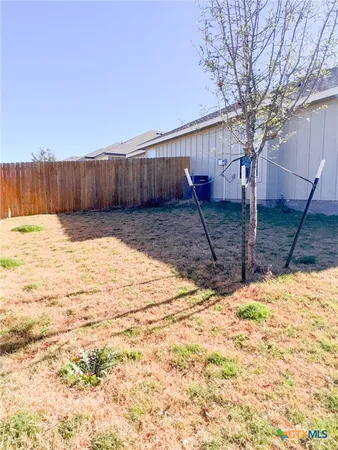 a view of a backyard of the house