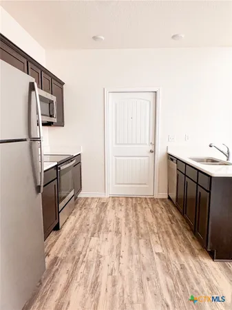 a view of a kitchen with a sink