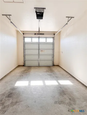 a view of a room with a ceiling fan