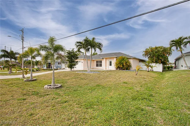 a house view with swimming pool