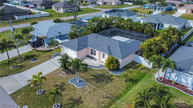 an aerial view of residential houses with outdoor space and street view
