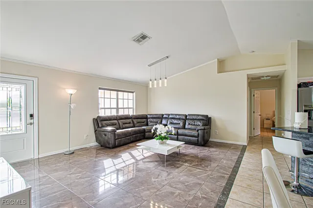 a living room with furniture and a couch