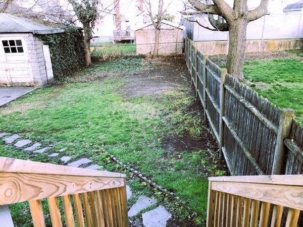 63 Irving Street Everett, MA 02149 - Photo 8 of 8 a view of a backyard with pathway