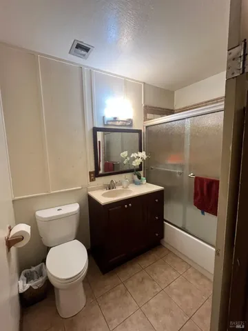 a bedroom with a bed and a bathroom